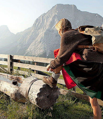 Woman at the fountain, (c) Tiroler Zugspitz Arena, Wiesmeier